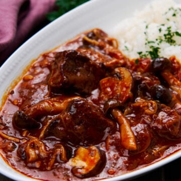 Fall apart tender beef stewed together with mushrooms and onions in a savory, sweet and tangy roux, Hayashi Rice is a popular Japanese stew.