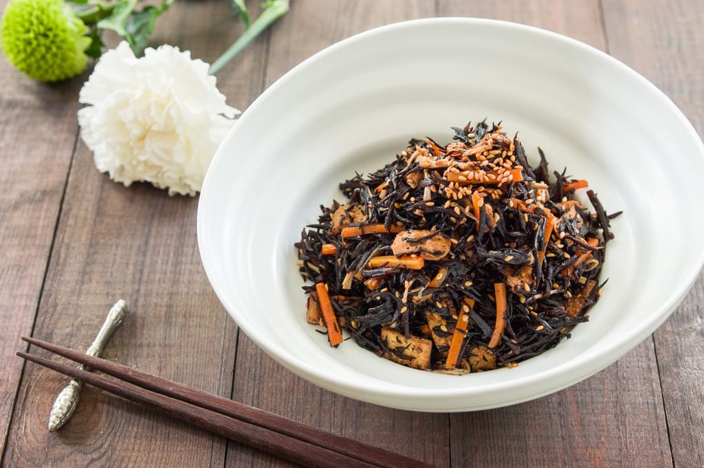 Hijiki no Nimono or Hijiki salad is a Japanese side dish made from seaweed, carrots, fried tofu simmered with soy sauce and sake.