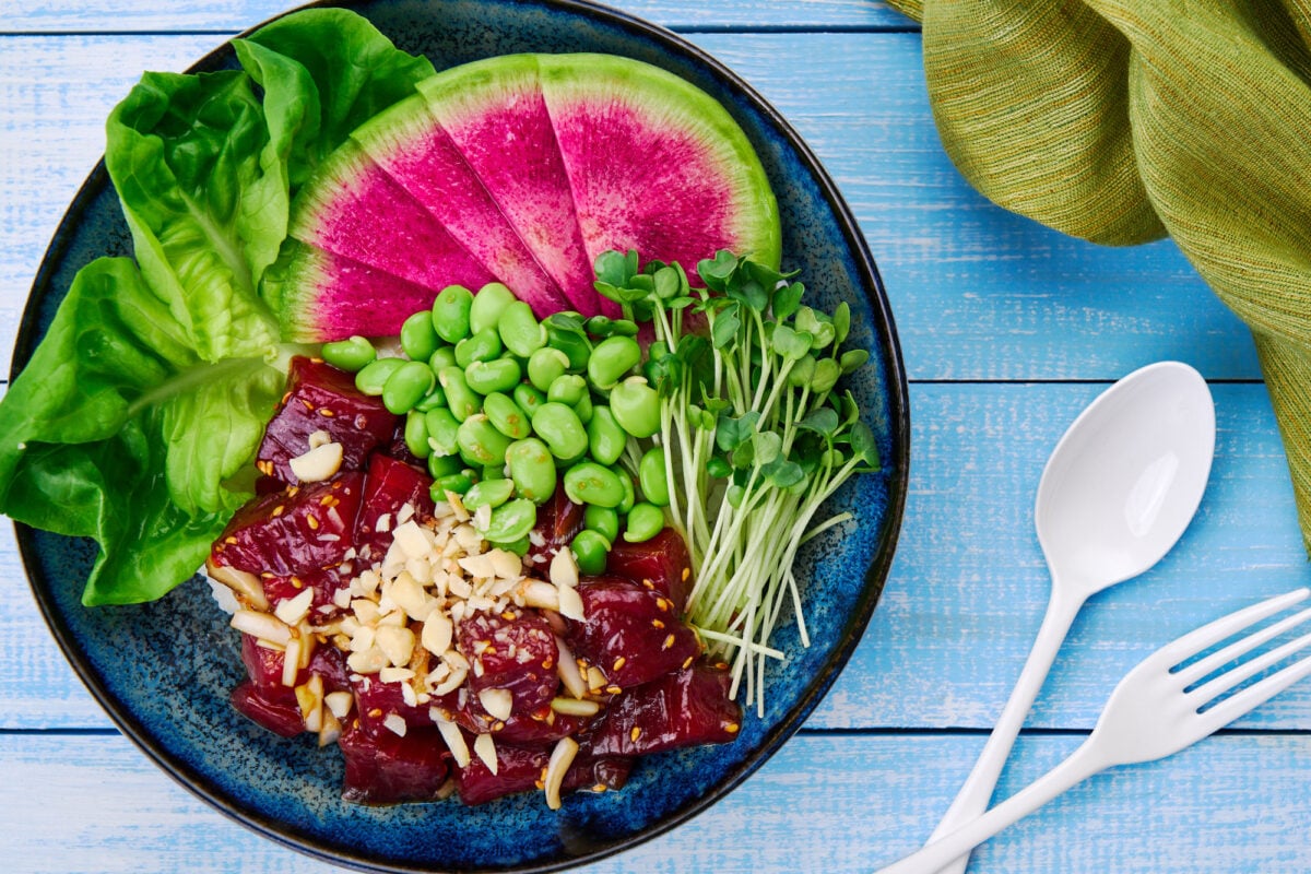 With fresh tuna marinated with sweet onions in soy sauce and sesame oil, this easy, colorful Poke Bowl is a balanced meal that comes together in about 10 minutes.