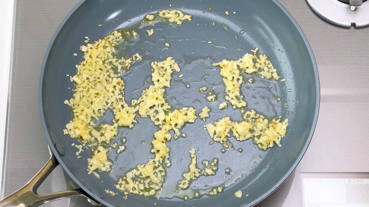 Sautéing garlic in olive oil.