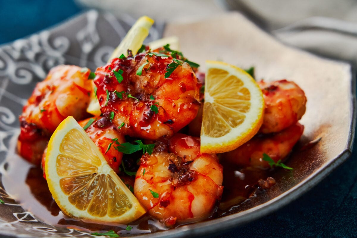 Caramelized honey and pungent garlic come together to make a sticky honey garlic glaze for this easy shrimp recipe.