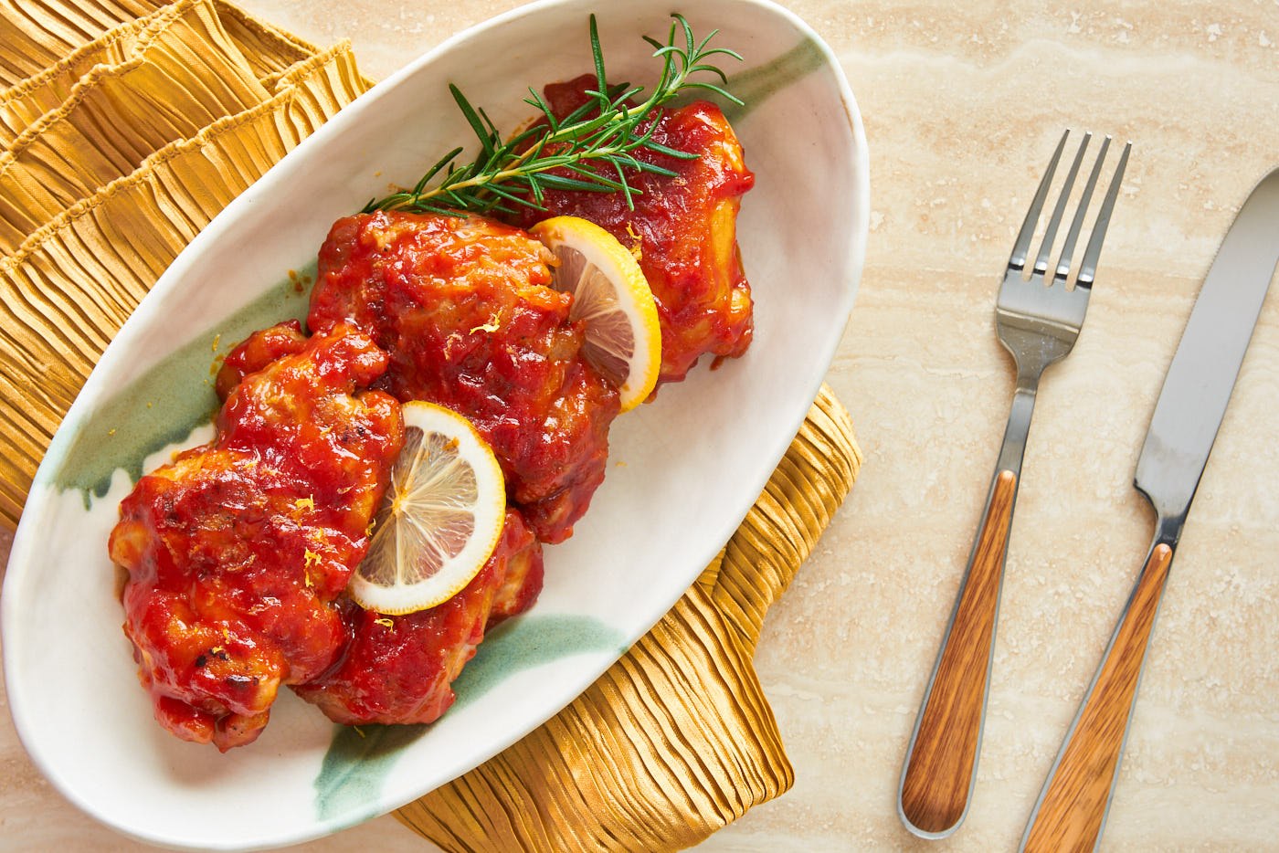 Redolemnt of garlic, this easy chicken entre is glazed with a tangy sweet honey lemon and tomato sauce.