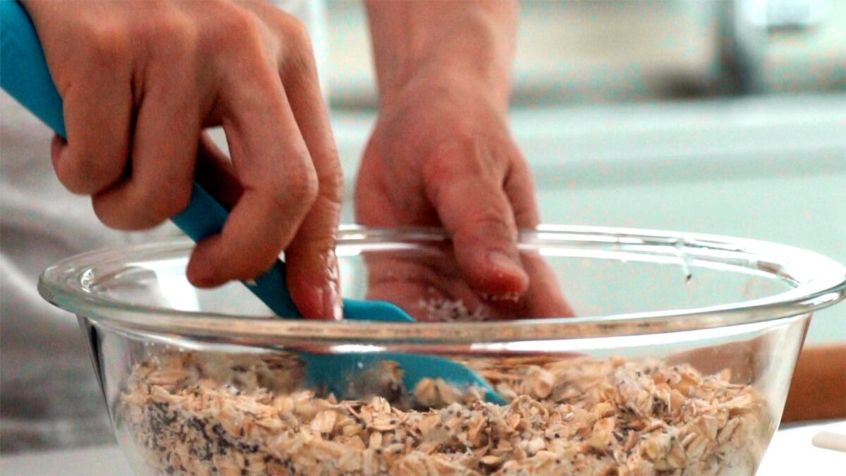 Mixing granola with spatula.