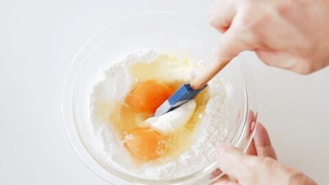 Making the dough for Nokedli with flour and eggs.