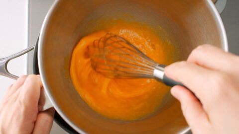 Whisking eggs for making Christmas Cake.