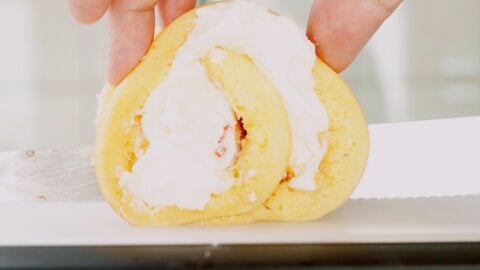 Trimming the ends off of rolled cake