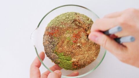 Blending Japanese curry powder in a glass bowl.