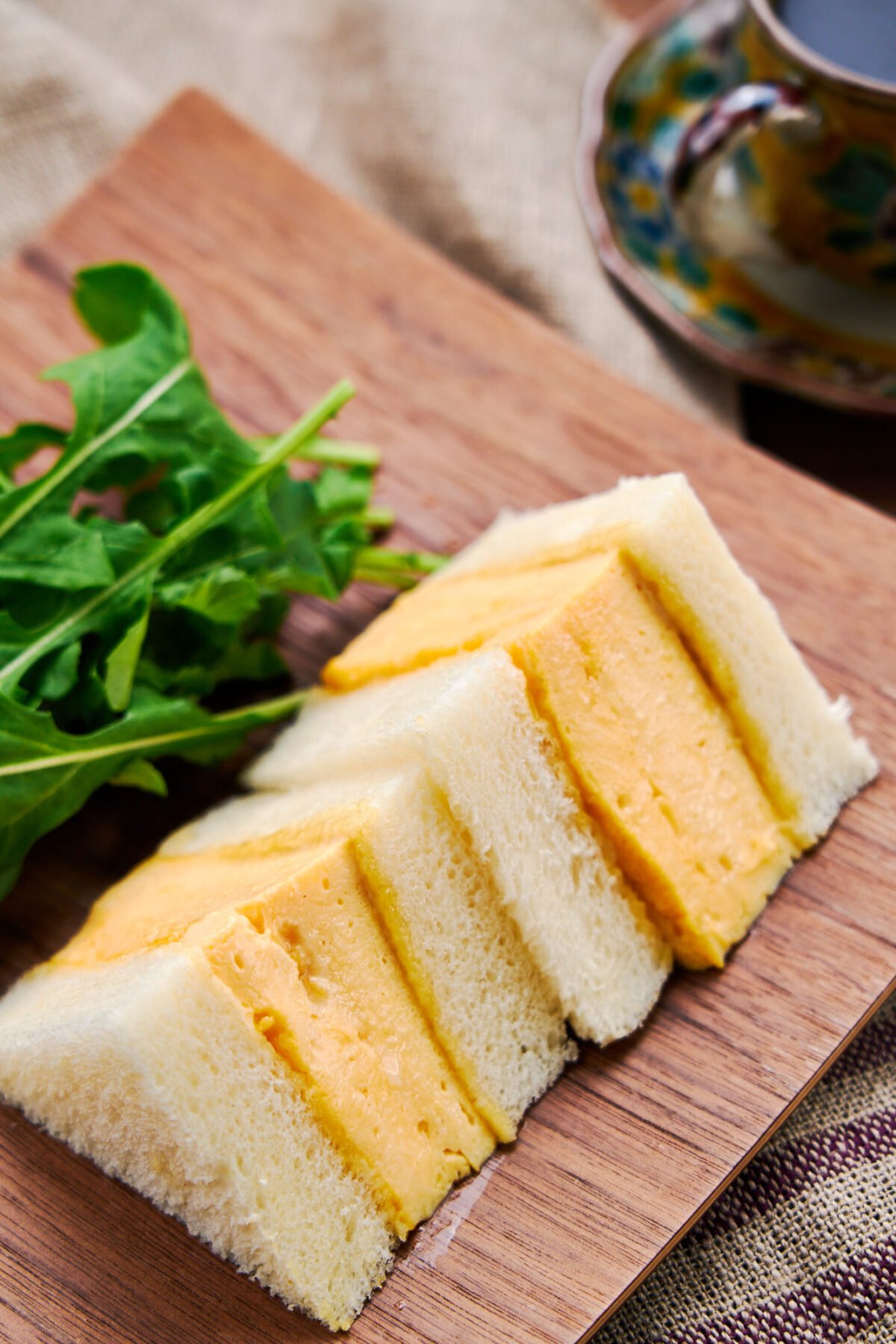 This Kyoto style Dashimaki Tamago Sando stuffs a tender, fluffy Japanese omelette between two thick slices of shokupan (Japanese sandwich bread) to make for a delightfully flavorful and satisfying egg sandwich.