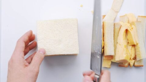 Cutting the crusts off of a Japanese Egg Sandwich.