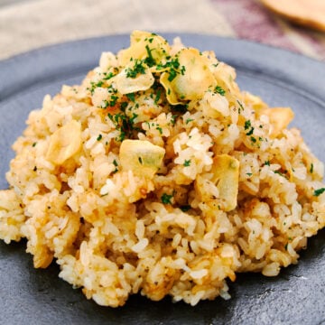 Teppanyaki (a.k.a. hibachi) style Japanese Garlic Fried Rice, with a double dose of garlic including crispy garlic chips and garlic butter.