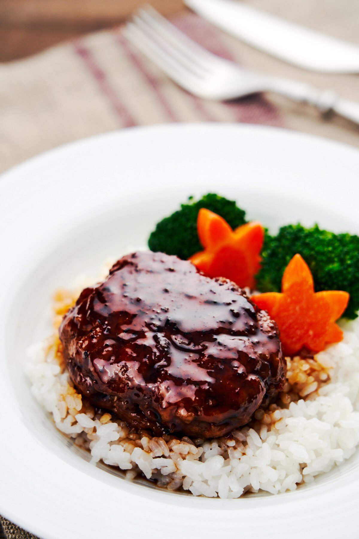 This mouthwatering Japanese Hamburg Steak recipe is glazed with an easy 3-ingredient teriyaki sauce.