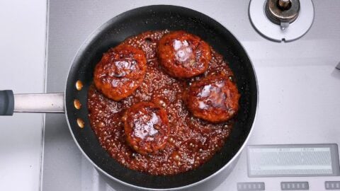 Glazing Hamburg Steak with Teriyaki sauce.