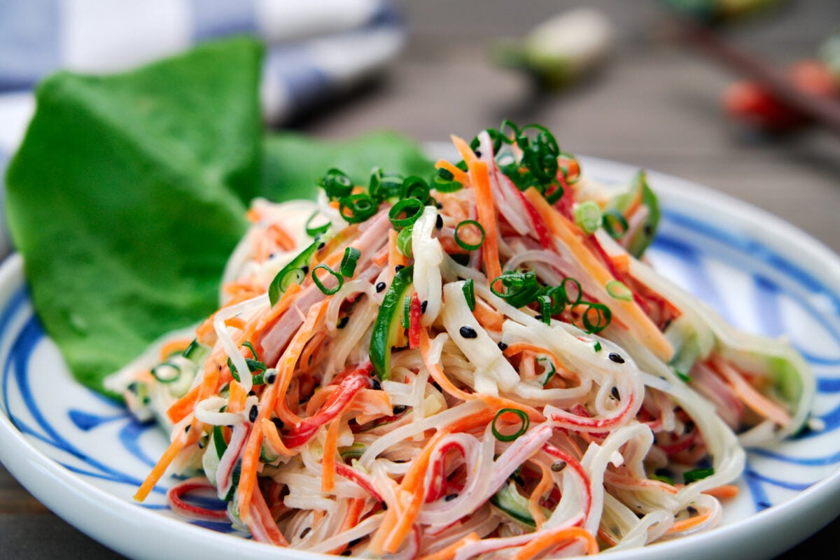 With shredded crab sticks, cucumbers, and carrots in a creamy lemon dressing, kani salad is an easy Japanese side salad you can make at home.