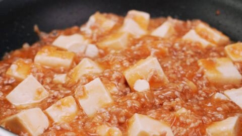 Japanese-style mapo tofu in frying pan.