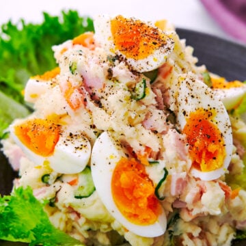 Japanese potato salad with boil eggs, ham, cucumbers, carrots, and onions.