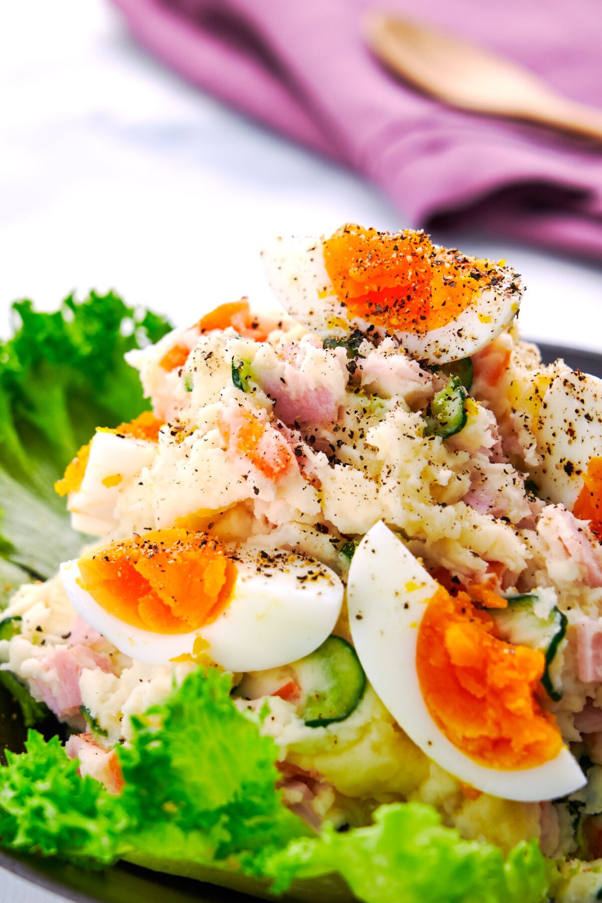 Loaded with vegetabes, egg and ham, this Japanese-style potato salad makes for an easy colorful side that's as fun to look at as it is to eat.