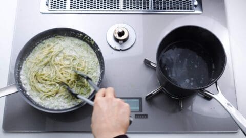 Tossing spaghetti with Japanese nori cream sauce.