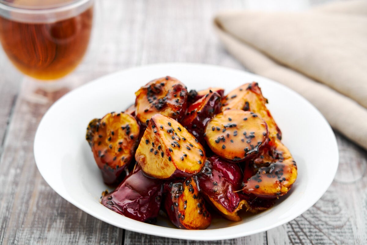 Daigaku Imo, or "college potatoes," is a classic Japanese street food made with sweet potatoes glazed in sticky syrup and sesame seeds.