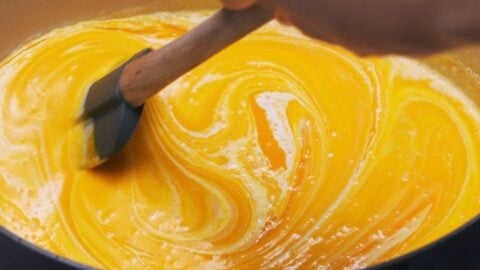 Stirring cream into Japanese pumpkin soup.