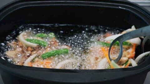 Frying a Japanese vegetable fritter, or kakiage.