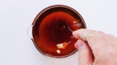 Sauce ingredients for Kanitama being mixed together in a glass bowl.