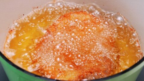 Deep frying pork cutlets to make Japanese Katsu Curry.