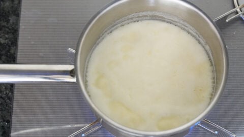 Boiling cream for making key lime pie filling.