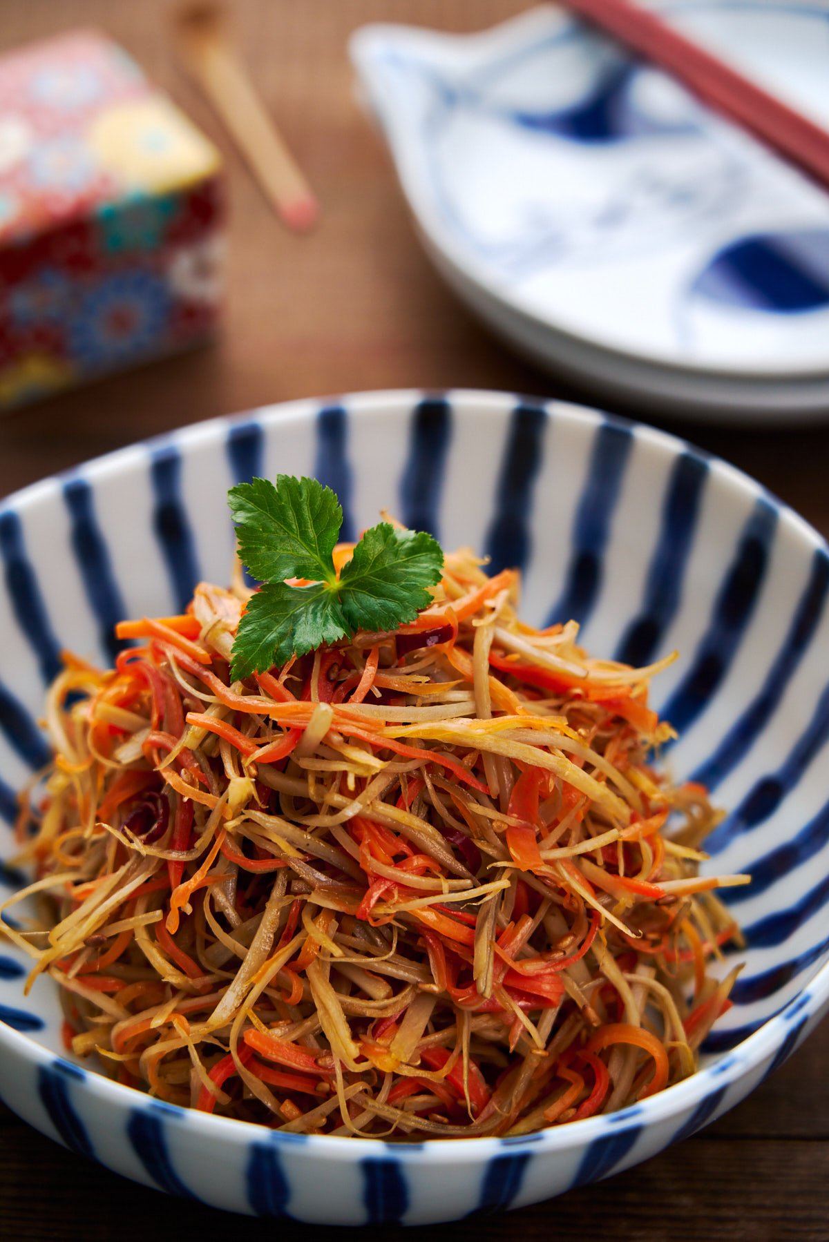 Kinpira Gobo is a delicious Japanese side dish made by stir-frying burdock root (gobo) and carrots with a savory-sweet sauce.