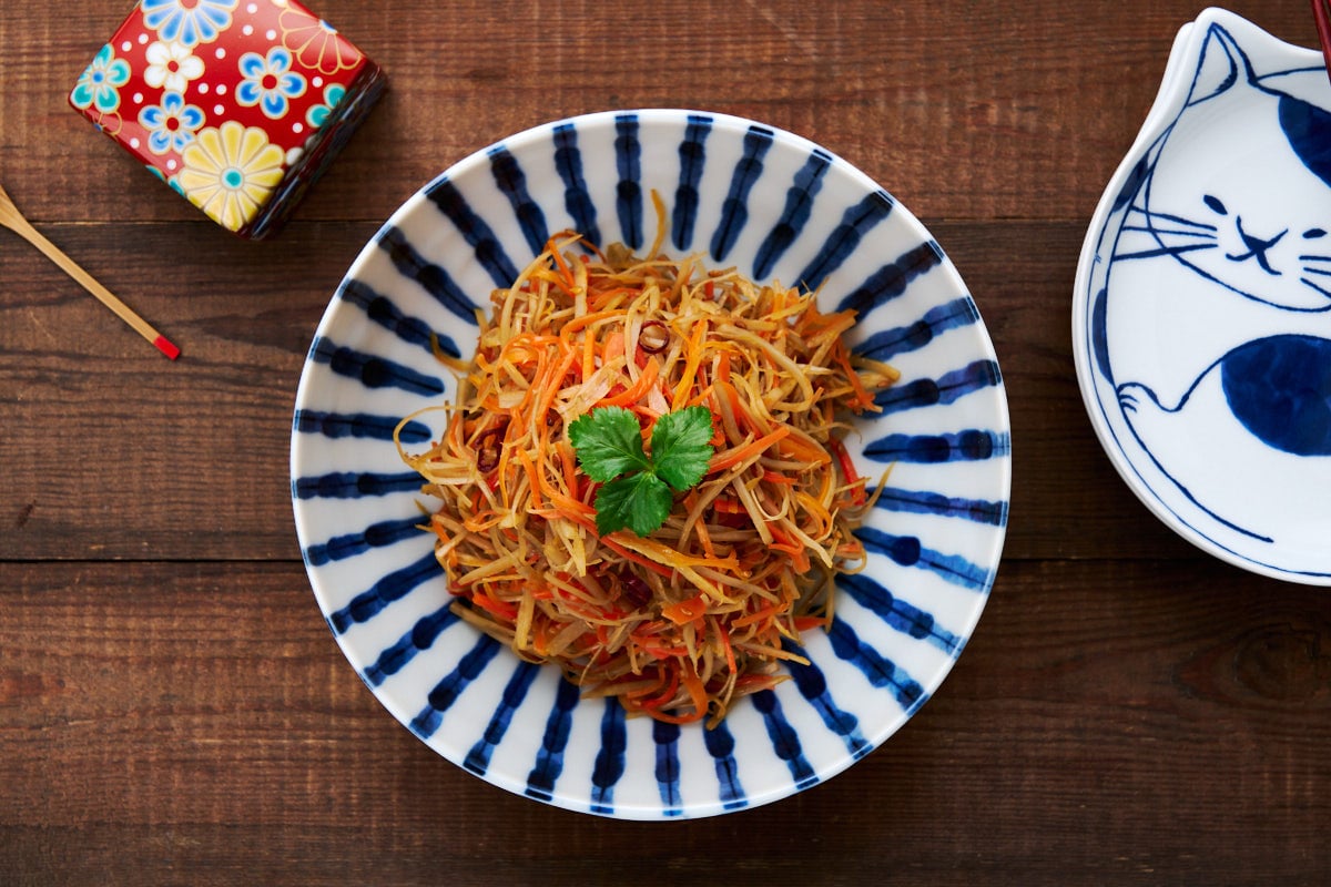 Kinpira Gobo is a mouthwatering Japanese side dish made by stir-frying thinly sliced burdock and carrots with a savory-sweet sauce.