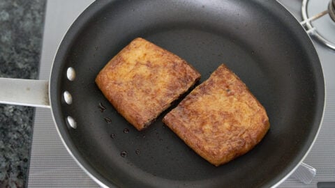 Kitsune udon is topped with abura-age (fried tofu) seasoned with soy sauce, sake and sugar.