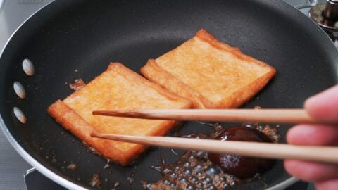 Cook the fried tofu with the soy sauce and sugar to make the Inari Agé.