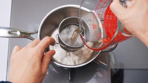 Strain the shiitake mushroom and konbu dashi through a sieve.