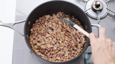 Sauteeing pork and onions for korokke filling.