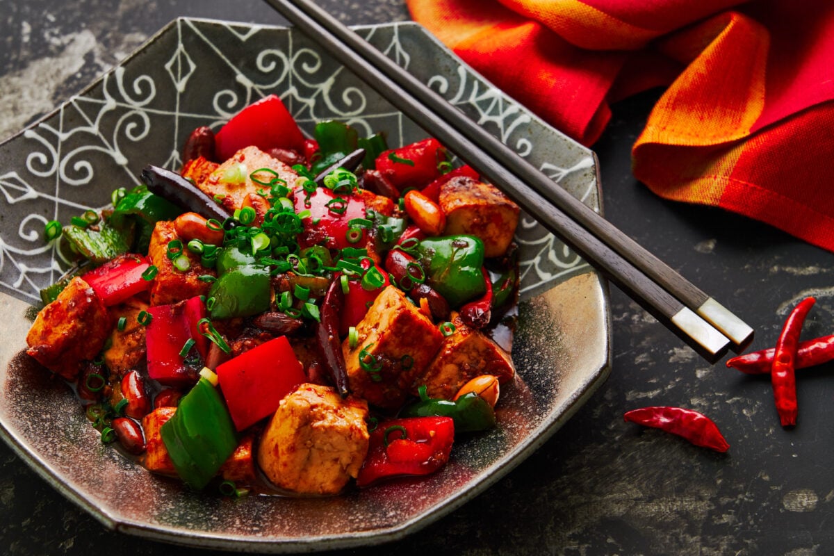 With meaty chunks of savory marinated tofu stir-fried with peanuts and peppers, this plant-based Kung Pao Tofu is loaded with contrasting tastes and textures that will keep you going back for more.