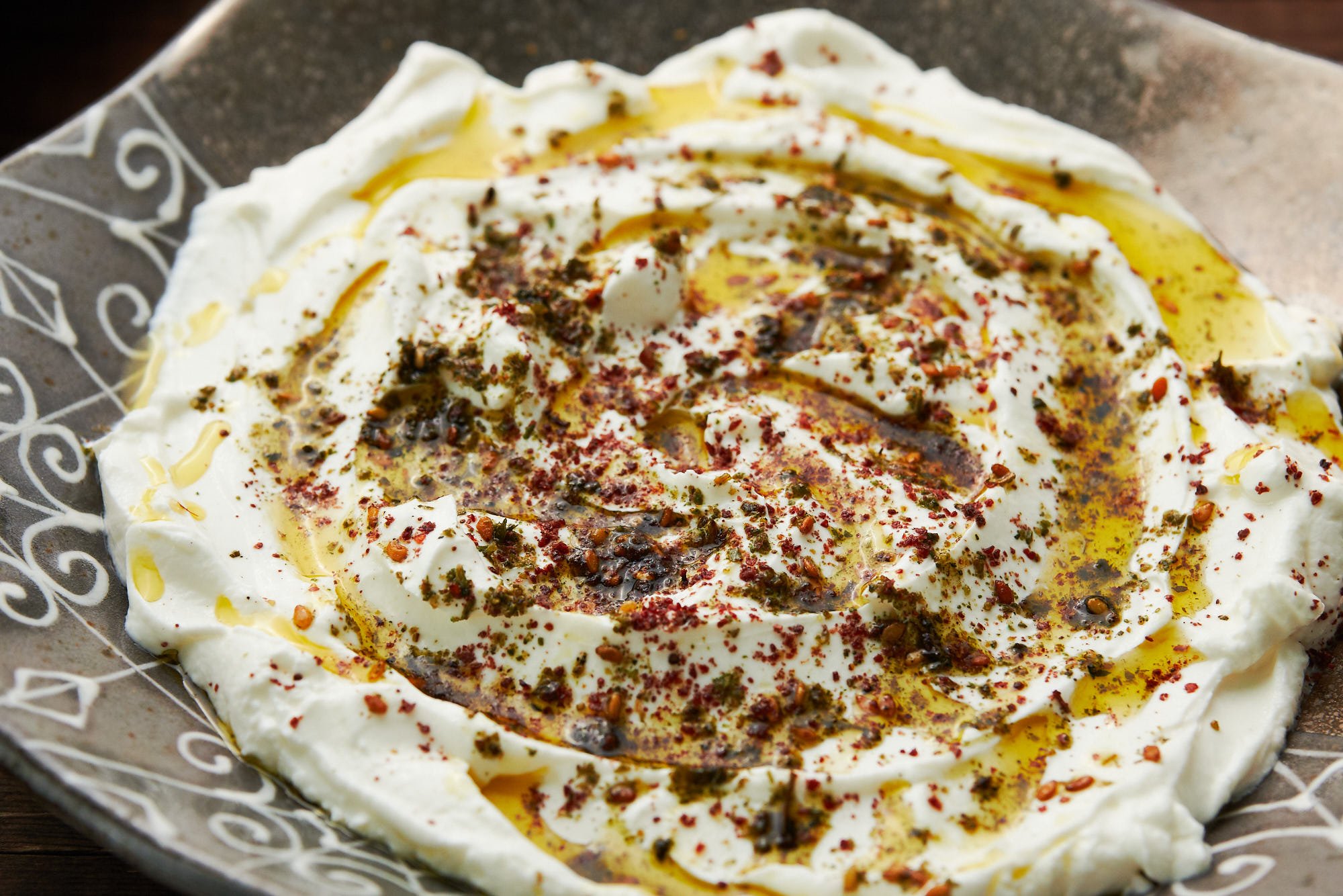 Fresh Labneh with olive oil, za'atar, and sumac.