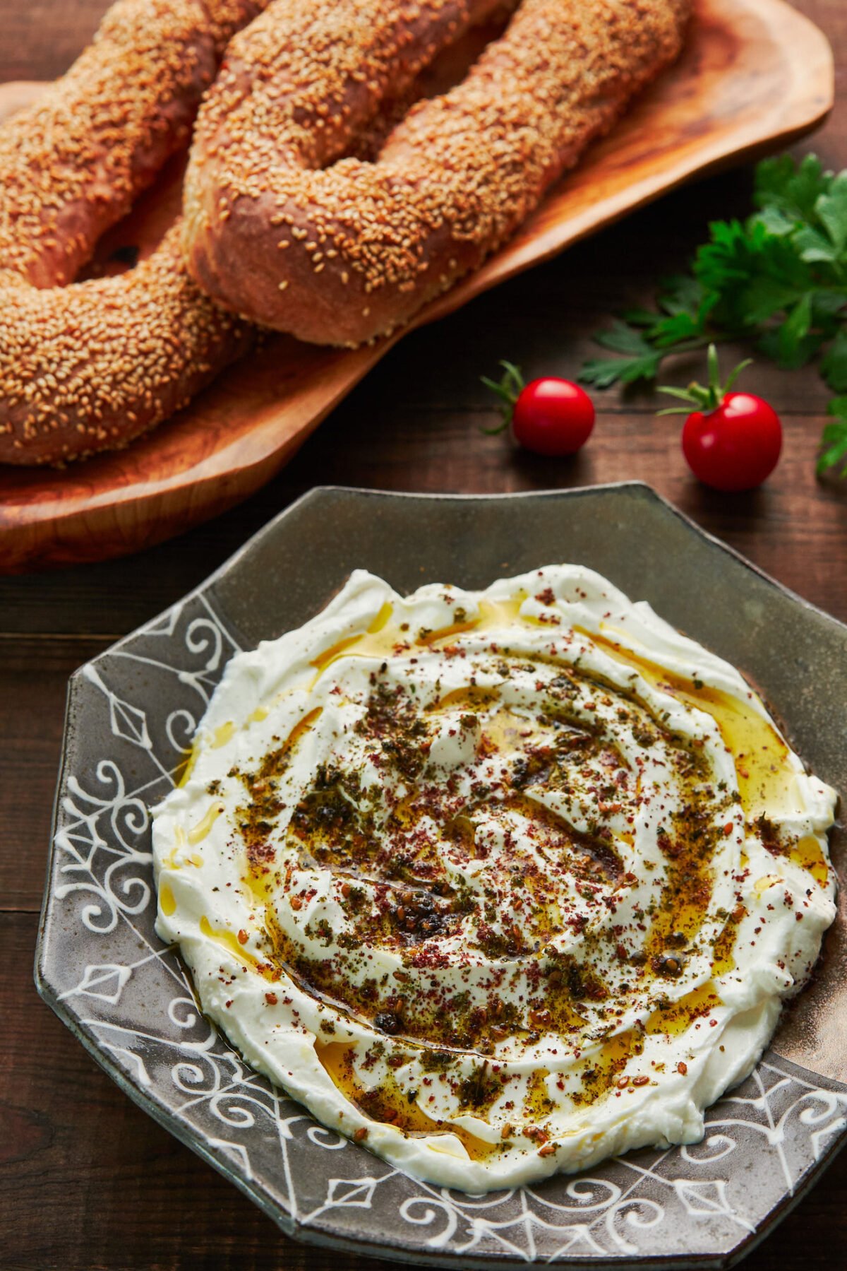 Labneh is a fresh cheese made by salting and straining yogurt, and it makes for a delicious condiment that's also great as a dip, mixed into sauces, and spread under salads. Show here with Jerusalem bagels.