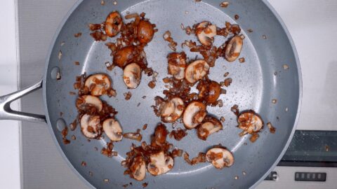 Sautéing mushrooms and onions for Loco Moco Gravy.