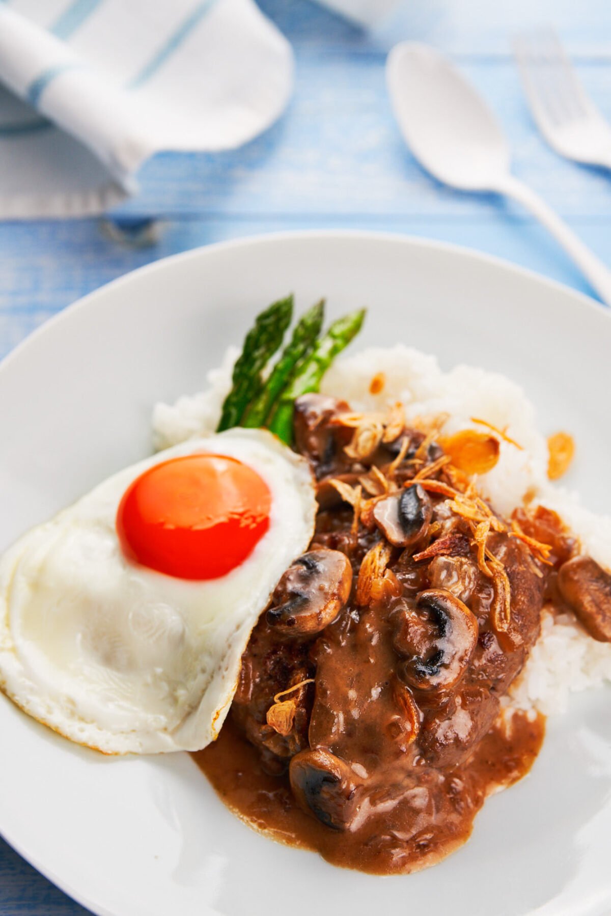 With tender seasoned hamburger patties smothered in pan-gravy, topped with a fried egg and crispy fried onions, Loco Moco is a mouthwatering Hawaiian classic that's easy to make and satisfying.