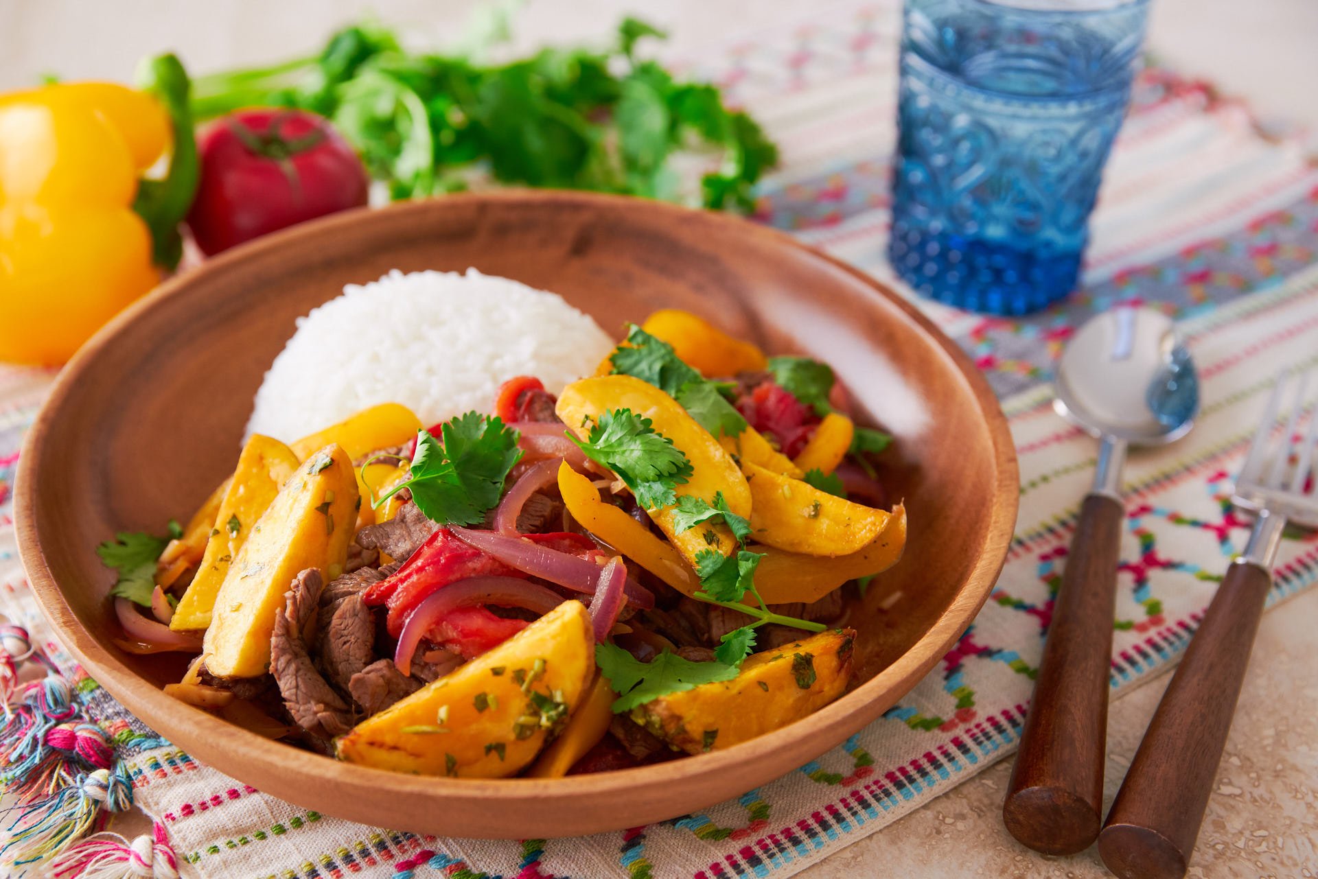 Lomo Saltado, or "jumped loin" is a delicious mashup of Peruvian and Chinese cuisines, featuring beef marinated with soy sauce and pisco stir-fried with onions, tomatoes, and peppers; and it's topped off with crisp French fries!