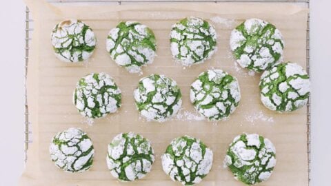 Matcha Crinkle Cookies cooling on a rack.