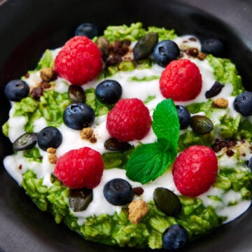 Matcha oatmeal makes for a delicious healthy breakfast with loads of fiber and antioxidents with a kick of caffeine. Topped with coconut cream, fresh berries, and pumpkin seeds.