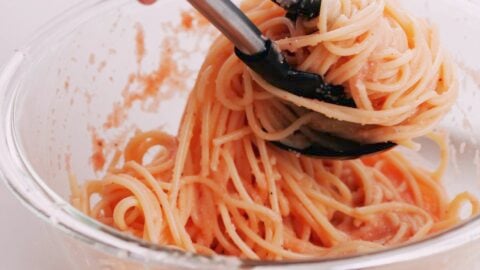 Tossing spaghetti with mentaiko sauce.