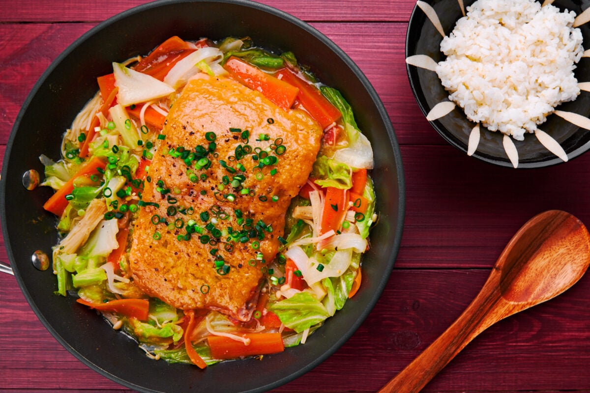 Tender salmon glazed with miso butter steamed atop a bed of cabbage, carrots, onions and mushroom.