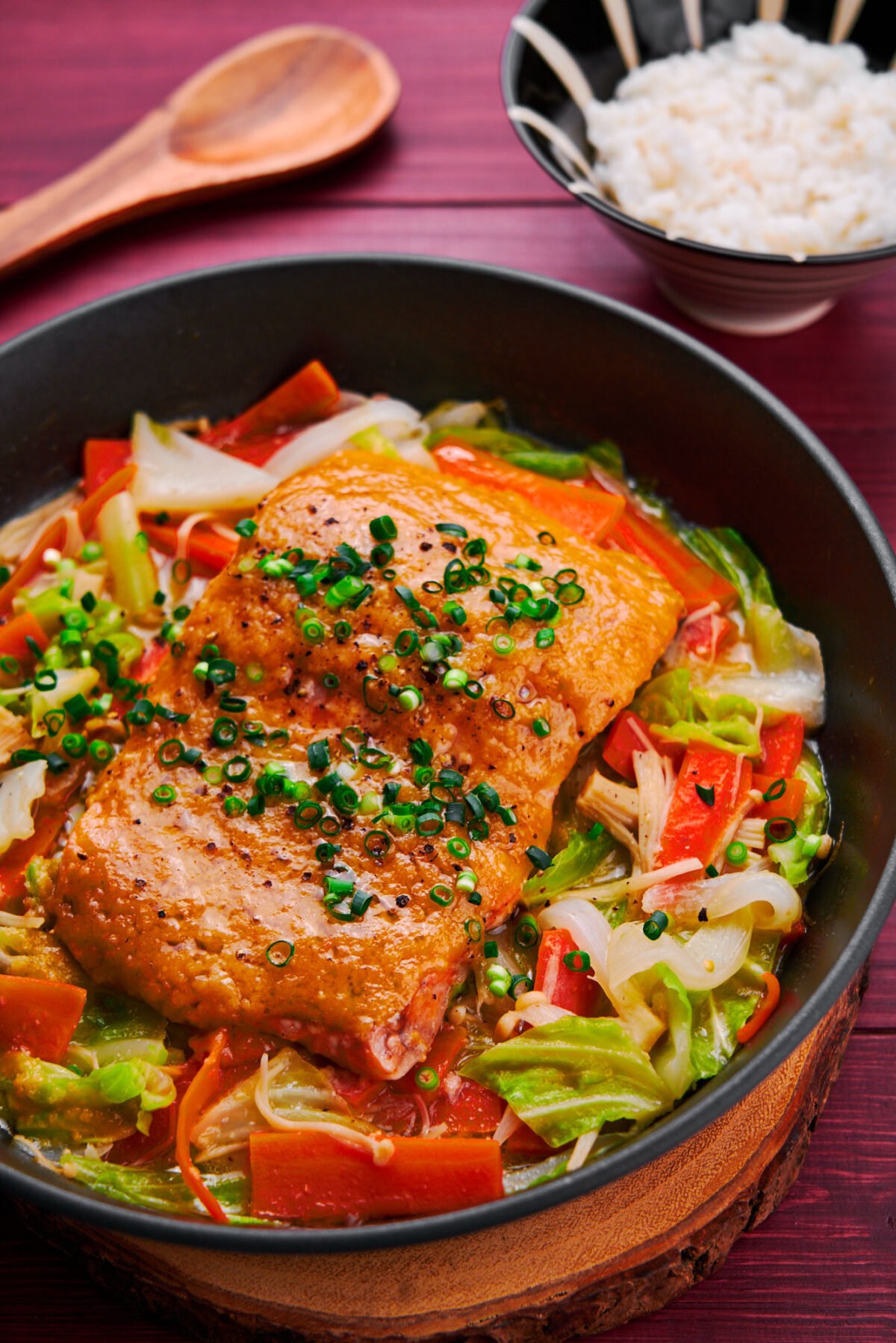 Melt-in-your-mouth salmon steamed on a bed of cabbage, carrots, and mushrooms with miso butter sauce.