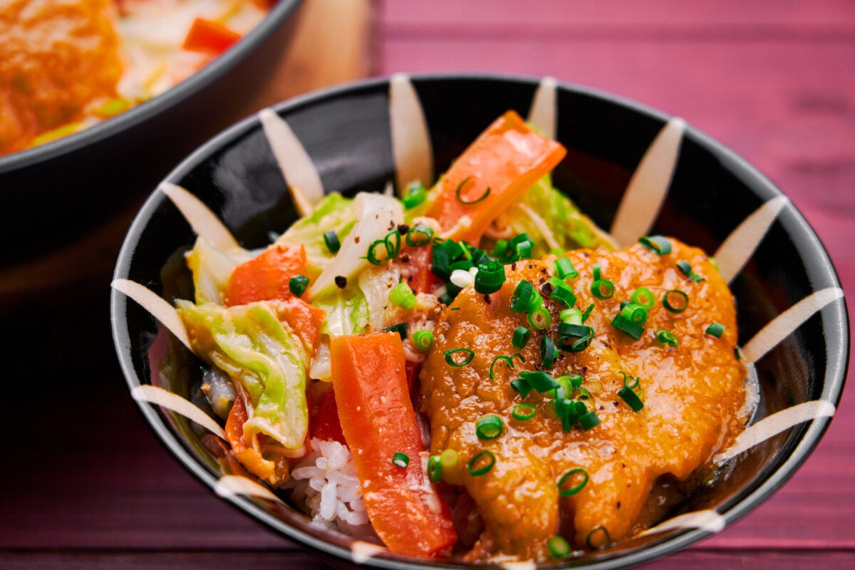 Miso Butter Salmon served on a bowl of rice.