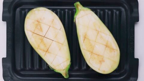 Eggplant scored, oiled and ready to roast.