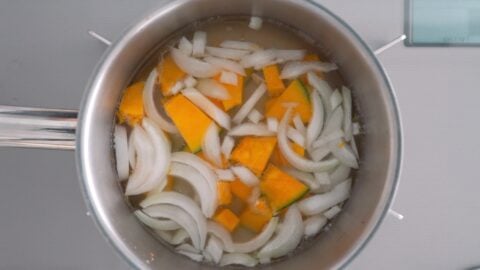 Onions and kabocha pumpkin simmering in Dashi for making miso soup.