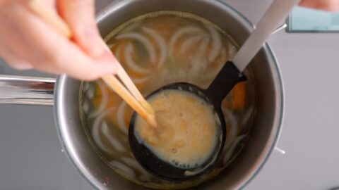 Dissolving white miso into miso soup.