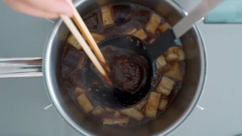 Dissolving red miso into miso soup.