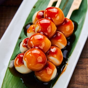 Soft, springy grilled rice dumplings glazed with a sweet and savory sauce. These traditional Japanese Mitarashi Dango make for a delicious snack.